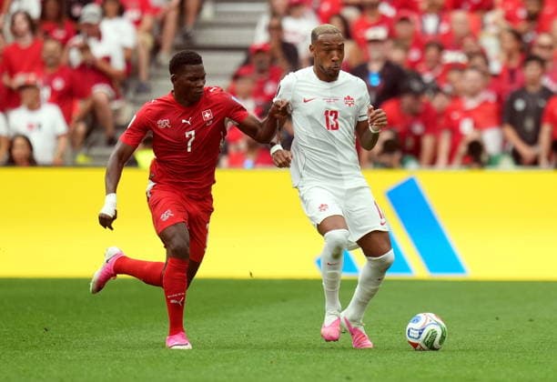 FIFA World Cup, WM, Weltmeisterschaft, Fussball 2026 - Group B - Switzerland vs Canada Breel Embolo of Switzerland (L) and Derek Cornelius of Canada in action during the FIFA World Cup 2026 group stage match Switzerland against Canada, in Vancouver, Canada, 24 June 2026. VANCOUVER Canada  Copyright: xBOBxFRIDx