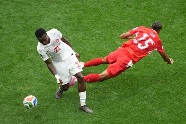 Switzerland v Canada - FIFA World Cup, WM, Weltmeisterschaft, Fussball 2026 - Group B VANCOUVER, CANADA - JUNE 24: Sow (15) of Switzerland in action against Jonathan Osorio (21) of Canada during the 2026 FIFA World Cup Group B match between Switzerland and Canada at BC Place Stadium in Vancouver, Canada, on June 24, 2026. Ercin Erturk Anadolu British Columbia Canada. Editorial use only. Please get in touch for any other usage.  Copyright: x2026xAnadoluxErcinxErturkx