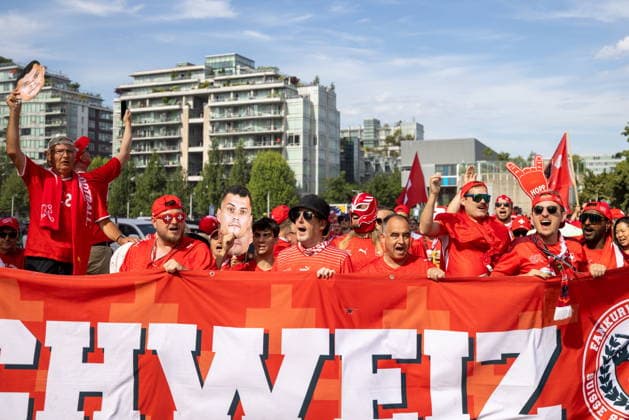 June 24, 2026, Vancouver, Bc, CANADA: Switzerland fans march toward B.C. Place before a World Cup Group B soccer match against Canada, in Vancouver, on Wednesday, June 24, 2026. Canada News - June 24, 2026  - ZUMAc35_ 20260624_zaf_c35_049 Copyright: xTimothyxMatweyx