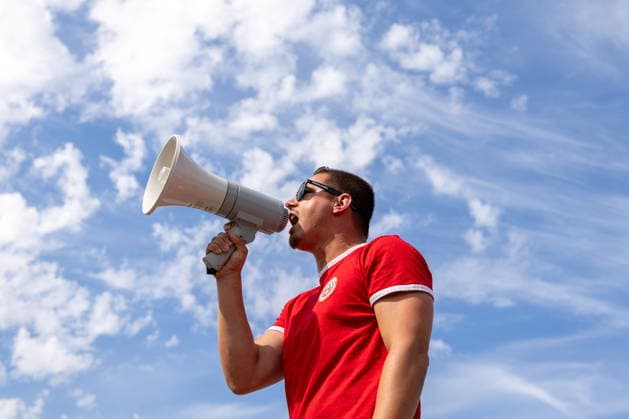 June 24, 2026, Vancouver, Bc, CANADA: A Switzerland supporter yells into a microphone as he leads a group of fans as they march toward B.C. Place before a World Cup Group B soccer match against Canada, in Vancouver, on Wednesday, June 24, 2026. Canada News - June 24, 2026  - ZUMAc35_ 20260624_zaf_c35_054 Copyright: xTimothyxMatweyx