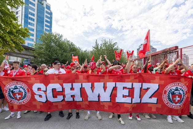 June 24, 2026, Vancouver, Bc, CANADA: Switzerland fans march toward B.C. Place before a World Cup Group B soccer match against Canada, in Vancouver, on Wednesday, June 24, 2026. Canada News - June 24, 2026  - ZUMAc35_ 20260624_zaf_c35_051 Copyright: xTimothyxMatweyx