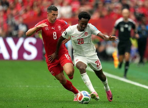 FIFA World Cup, WM, Weltmeisterschaft, Fussball 2026 - Group B - Switzerland vs Canada Ali Ahmed of Canada (R) and Remo Freuler of Switzerland in action during the FIFA World Cup 2026 group stage match Switzerland against Canada, in Vancouver, Canada, 24 June 2026. VANCOUVER Canada  Copyright: xBOBxFRIDx