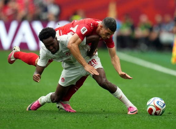 FIFA World Cup, WM, Weltmeisterschaft, Fussball 2026 - Group B - Switzerland vs Canada Ali Ahmed of Canada (front) and Remo Freuler of Switzerland in action during the FIFA World Cup 2026 group stage match Switzerland against Canada, in Vancouver, Canada, 24 June 2026. VANCOUVER Canada  Copyright: xBOBxFRIDx