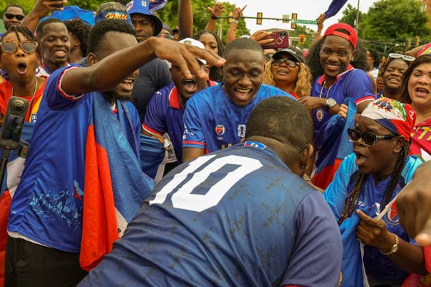 June 24, 2026, Atlanta, Georgia, United States of America: Haiti fans celebrating in a circle during the Haiti fan march before the Morocco vs Haiti First Stage Group C match in ATLANTA, Georgia. World Cup 2026: Group C: Morocco : Haiti  - ZUMAg276 20260624_zsp_g276_014 Copyright: xMalachixGabrielx