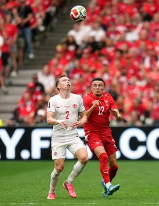 FIFA World Cup, WM, Weltmeisterschaft, Fussball 2026 - Group B - Switzerland vs Canada Alistair Johnston of Canada (L) and Ruben Vargas of Switzerland in action during the FIFA World Cup 2026 group stage match Switzerland against Canada, in Vancouver, Canada, 24 June 2026. VANCOUVER Canada  Copyright: xBOBxFRIDx