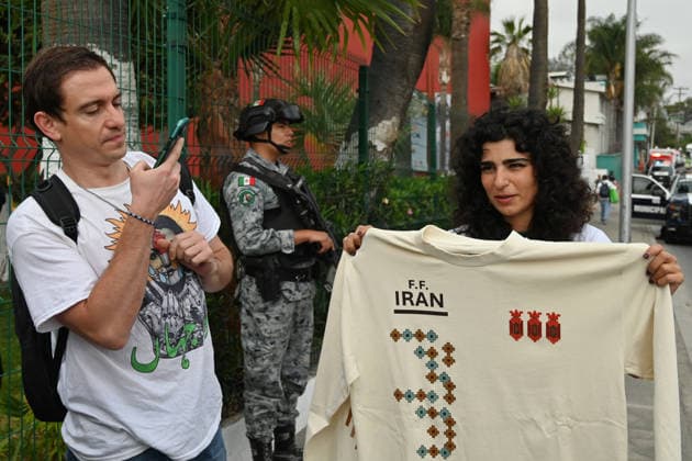 Iranian national team, Nationalteam FIFA World Cup, WM, Weltmeisterschaft, Fussball 2026 leave Mexico camp to Seattle match to face Egypt TIJUANA, MEXICO - JUNE 24: Yalda (right), a Tijuana-based Iranian citizen, who works as a painter, shows off t-shirts she produced for the Iranian National team before their leave from the Marriott Hotel to the Tijuana International Airport upon the team’s departure for Seattle, Washington, where it will play against Egypt on Friday in Tijuana, Mexico, on Wednesday, June 24, 2026, as part of the 2026 World Cup football tournament. (Carlos A. Moreno for Anadolu Images) Carlos Moreno Anadolu Tijuana Mexico. Editorial use only. Please get in touch for any other usage.  Copyright: x2026xAnadoluxCarlosxMorenox