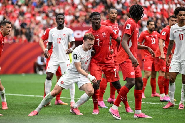 Alistair Johnston of Canada and Breel Embolo of Switzerland, Switzerland v Canada, Group B football match of the FIFA World Cup, WM, Weltmeisterschaft, Fussball 2026 at BC Place, Vancouver, Canada on Wednesday 24 June 2026. Photo: Andrew Cornaga Vancouver Canada Copyright: xAndrewxCornaga x