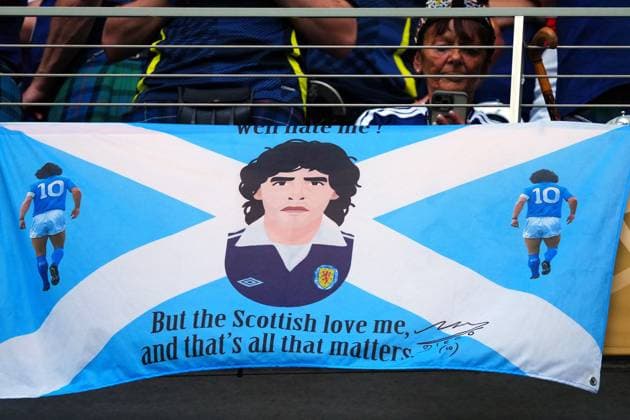 Scotland flag featuring Diego Maradona Scotland v Brazil, 2026 FIFA World Cup, WM, Weltmeisterschaft, Fussball Group C, Football, Miami Stadium, Miami, Florida, USA - 24 Jun 2026Miami Miami Stadium Florida (FL) United States of America EDITORIAL USE ONLY No use with unauthorised audio, video, data, fixture lists, club league logos or live services. Online in-match use limited to 120 images, no video emulation. No use in betting, games or single club league player publications.  Copyright: xJavierxGarcia Shutterstockx 16956030af