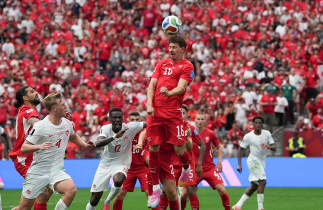 (260625) -- VANCOUVER, June 25, 2026 -- Christian Fassnacht (top) of Switzerland jumps for a header during the group B match between Switzerland and Canada at the 2026 FIFA World Cup, WM, Weltmeisterschaft, Fussball at BC Place Vancouver in Vancouver, Canada, June 24, 2026. ) (SP)CANADA-VANCOUVER-FOOTBALL-FIFA WORLD CUP-GROUP B-SUI VS CAN MengxYongmin 