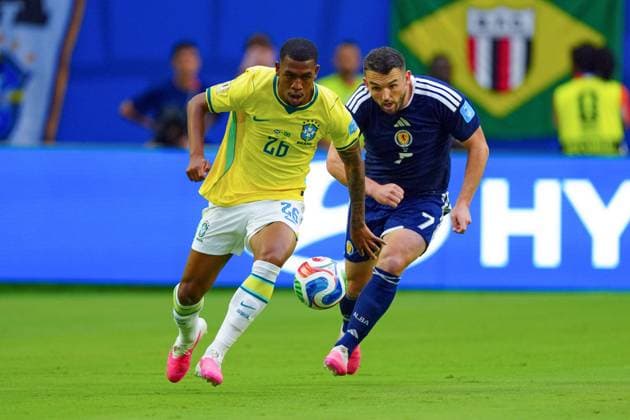 Rayan of Brazil and John McGinn of Scotland Scotland v Brazil, 2026 FIFA World Cup, WM, Weltmeisterschaft, Fussball Group C, Football, Miami Stadium, Miami, Florida, USA - 24 Jun 2026Miami Miami Stadium Florida (FL) United States of America EDITORIAL USE ONLY No use with unauthorised audio, video, data, fixture lists, club league logos or live services. Online in-match use limited to 120 images, no video emulation. No use in betting, games or single club league player publications.  Copyright: xJavierxGarcia Shutterstockx 16956030ao