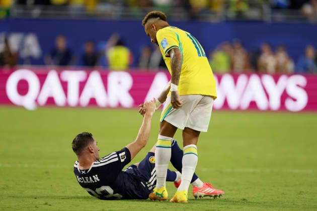 Scotland v Brazil: Group C - FIFA World Cup, WM, Weltmeisterschaft, Fussball 2026 Kenny McLean of Scotland is helped up by Neymar of Brazil after the FIFA World Cup 2026 Group C match between Scotland and Brazil at Miami Stadium on June 24, 2026 in Miami, United States. Miami Gardens Miami Stadium FL United States Copyright: xAllstarxPicturexLibraryxLtdx