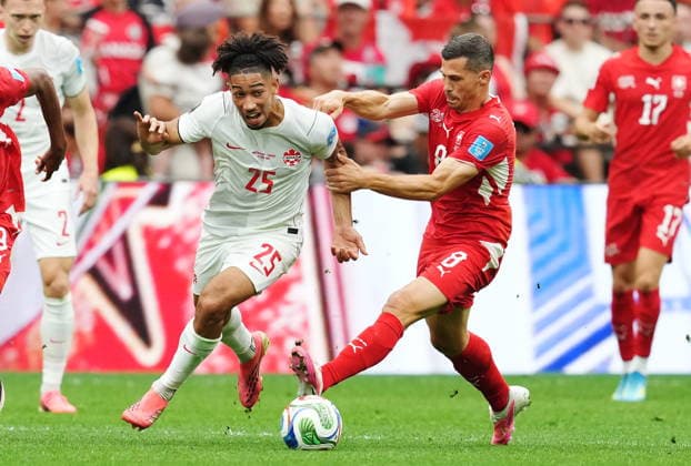 June 24, 2026, Vancouver, Bc, CANADA: Canada s Nathan-Dylan Saliba (25) and Switzerland s Remo Freuler (8) vie for the ball during the first half of a World Cup Group B soccer match, in Vancouver, on Wednesday, June 24, 2026. Canada News - June 24, 2026  - ZUMAc35_ 20260624_zaf_c35_189 Copyright: xEthanxCairnsx