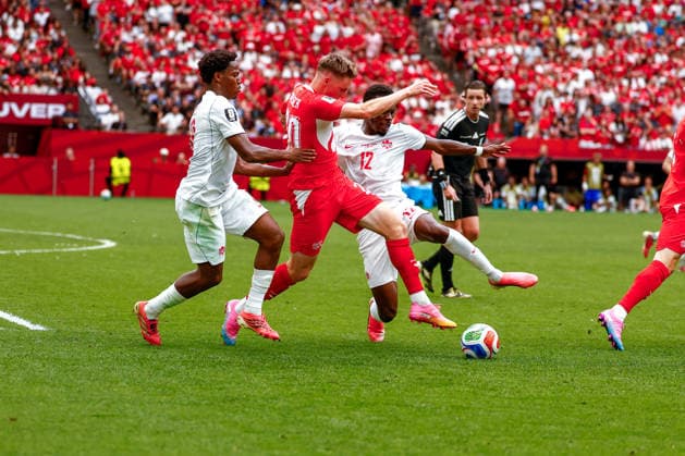 June 24, 2026, Vancouver, British Columbia, Canada: ALI AHMED (20) of Canada and YVON MVOGO (12) of Switzerland struggle to get the ball. Canada vs. Switzerland in FIFA World Cup, WM, Weltmeisterschaft, Fussball group stage play held at BC Place Stadium in Vancouver, BC Canada 2026 Soccer: Canada 1:2 Switzerland  - ZUMAk184 20260624_zsp_k184_035 Copyright: xGordonxKalischx