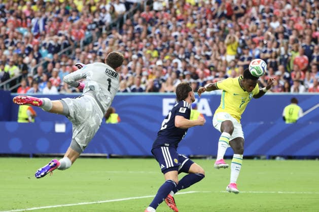 MIAMI GARDENS, FL - JUNE 24: Brazil forward Vinicius Junior (7) heads the ball in for a goal as Scotland goalkeeper Angus Gunn (1) can™t quite defelct the pass in the first half during the FIFA World Cup, WM, Weltmeisterschaft, Fussball 2026 Group C match between Scotland and Brazil on Wednesday, June 24, 2026 at Miami Stadium in Miami Gardens, FL (Photo by Peter Joneleit Icon Sportswire) SOCCER: JUN 24 FIFA World Cup 26 Group C - Scotland vs Brazil EDITORIAL USE ONLY Icon260624029