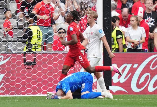 June 24, 2026, Vancouver, Bc, CANADA: Switzerland s Johan Manzambi (9) celebrates his goal on Canada goalkeeper Maxime Crepeau (16) as Luc de Fougerolles (4) looks on during the second half of a World Cup Group B soccer match, in Vancouver, on Wednesday, June 24, 2026. Canada News - June 24, 2026  - ZUMAc35_ 20260624_zaf_c35_213 Copyright: xDarrylxDyckx