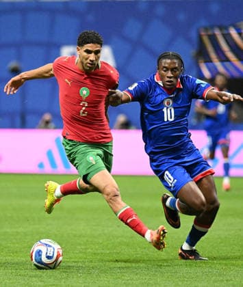 (260625) -- ATLANTA, June 25, 2026 -- Achraf Hakimi (L) of Morocco vies with Jean-Ricner Bellegarde of Haiti during the group C match between Morocco and Haiti at the 2026 FIFA World Cup, WM, Weltmeisterschaft, Fussball at Atlanta Stadium in Atlanta, the United States, June 24, 2026. ) (SP)U.S.-ATLANTA-FOOTBALL-FIFA WORLD CUP-GROUP C-MAR VS HTI JuxHuanzong 