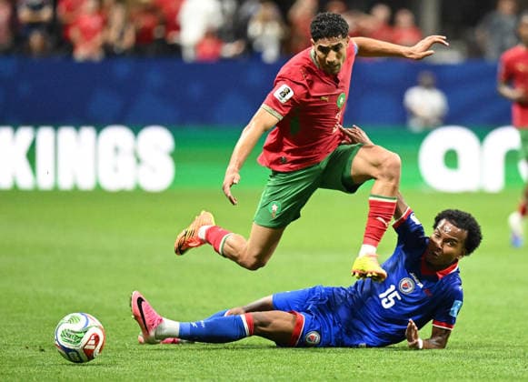 (260625) -- ATLANTA, June 25, 2026 -- Achraf Hakimi (top) of Morocco vies with Ruben Providence of Haiti during the group C match between Morocco and Haiti at the 2026 FIFA World Cup, WM, Weltmeisterschaft, Fussball at Atlanta Stadium in Atlanta, the United States, June 24, 2026. ) (SP)U.S.-ATLANTA-FOOTBALL-FIFA WORLD CUP-GROUP C-MAR VS HTI JuxHuanzong 