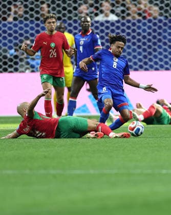 (260625) -- ATLANTA, June 25, 2026 -- Martin Experience (1st R) of Haiti competes with Sofyan Amrabat of Morocco (bottom) during the group C match between Morocco and Haiti at the 2026 FIFA World Cup, WM, Weltmeisterschaft, Fussball at Atlanta Stadium in Atlanta, the United States, June 24, 2026. ) (SP)U.S.-ATLANTA-FOOTBALL-FIFA WORLD CUP-GROUP C-MAR VS HTI WangxKaiyan 