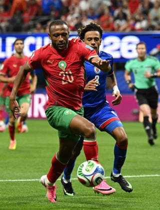 (260625) -- ATLANTA, June 25, 2026 -- Ayoub El Kaabi (L) of Morocco vies with Martin Experience of Haiti during the group C match between Morocco and Haiti at the 2026 FIFA World Cup, WM, Weltmeisterschaft, Fussball at Atlanta Stadium in Atlanta, the United States, June 24, 2026. ) (SP)U.S.-ATLANTA-FOOTBALL-FIFA WORLD CUP-GROUP C-MAR VS HTI JuxHuanzong 