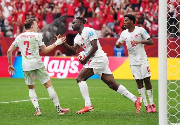 June 24, 2026, Vancouver, Bc, CANADA: Canada s Promise David (24) retrieves the ball and celebrates his goal against Switzerland with Alistair Johnston (2) and Jonathan David (10) during the second half of a World Cup Group B soccer match, in Vancouver, on Wednesday, June 24, 2026. Canada News - June 24, 2026  - ZUMAc35_ 20260624_zaf_c35_226 Copyright: xDarrylxDyckx