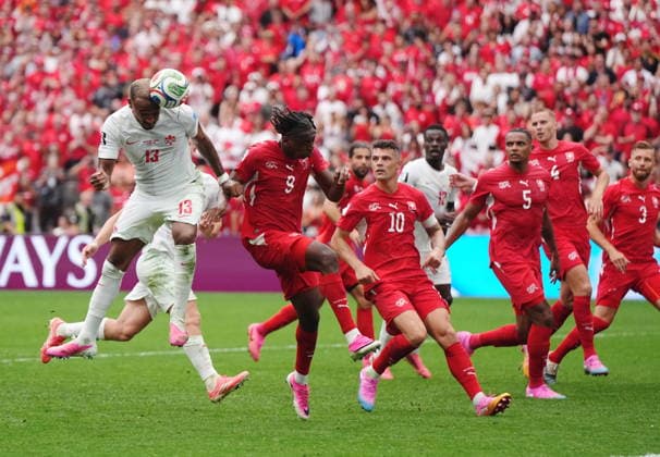 June 24, 2026, Vancouver, Bc, CANADA: Canada s Derek Cornelius (13) heads the ball as Switzerland s Johan Manzambi (9) defends during the second half of a World Cup Group B soccer match, in Vancouver, on Wednesday, June 24, 2026. Canada News - June 24, 2026  - ZUMAc35_ 20260624_zaf_c35_227 Copyright: xDarrylxDyckx