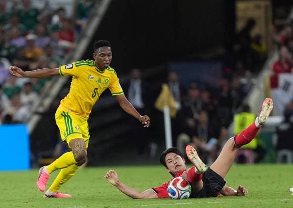 South Africa v South Korea - FIFA World Cup, WM, Weltmeisterschaft, Fussball 2026 - Group A MONTERREY, MEXICO - JUNE 24: Thalente Mbatha (5) of South Africa in action against Seol Young-woo (ground) of South Korea during the 2026 FIFA World Cup First Stage Group A match between South Africa and South Korea at Estadio BBVA (Monterrey Stadium) in Monterrey, Mexico on June 24, 2026. Juancho Torres Anadolu Nuevo Leon Mexico. Editorial use only. Please get in touch for any other usage.  Copyright: x2026xAnadoluxJuanchoxTorresx