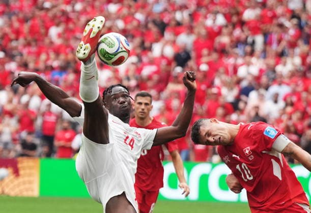 June 24, 2026, Vancouver, Bc, CANADA: Canada s Promise David (24) takes a shot on goal as Switzerland s Granit Xhaka (10) defends during the second half of a World Cup Group B soccer match, in Vancouver, on Wednesday, June 24, 2026. Canada News - June 24, 2026  - ZUMAc35_ 20260624_zaf_c35_234 Copyright: xDarrylxDyckx