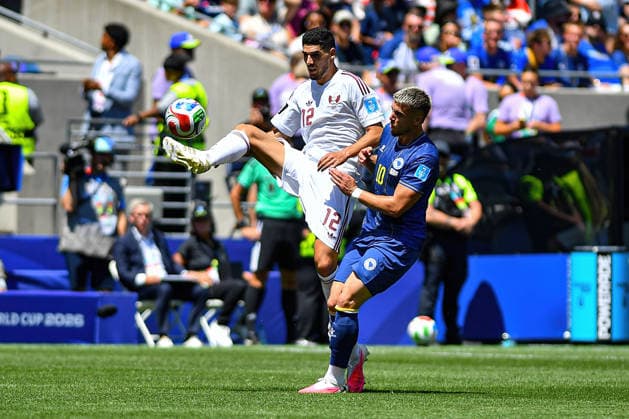 June 24, 2026: Qatar midfielder Karim Boudiaf (12) makes airborne contact with the ball past Bosnia and Herzegovina forward Ermedin DemiroviÄ¡ (10) during the FIFA World Cup, WM, Weltmeisterschaft, Fussball match between Bosnia - Herzegovina and Qatar in Seattle, WA.Bosnia - Herzegovina defeated Qatar 3-1. CSM Seattle United States - ZUMAc04_ 20260624_zma_c04_044 Copyright: xStevexFaberx