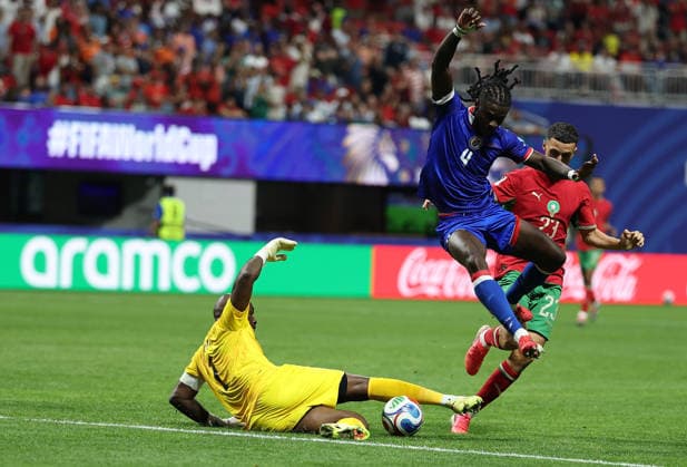 (260625) -- ATLANTA, June 25, 2026 -- Johny Placide (L), goalkeeper of Haiti, tries to save the ball during the group C match between Morocco and Haiti at the 2026 FIFA World Cup, WM, Weltmeisterschaft, Fussball at Atlanta Stadium in Atlanta, the United States, June 24, 2026. ) (SP)U.S.-ATLANTA-FOOTBALL-FIFA WORLD CUP-GROUP C-MAR VS HTI WangxKaiyan 