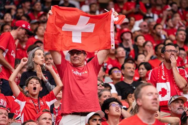 VANCOUVER, CANADA - JUNE 24: A fan supporter of Switzerland stands up and holds the flag of Switzerland after the team scores their first goal during the FIFA World Cup, WM, Weltmeisterschaft, Fussball 2026 group stage match between Canada and Switzerland at BC Place Vancouver Stadium on June 24, 2026 in Vancouver, British Columbia, Canada.  Copyright: xAmyxElle SPPx Sportspressphoto_SPR176222