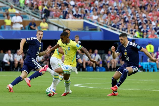 MIAMI GARDENS, FL - JUNE 24: Rayan 26 of Brazil and Scott McKenna 26 of Scotland battle for a ball during a FIFA World Cup, WM, Weltmeisterschaft, Fussball 2026 Group C match between Scotland and Brazil on June 24,2026 at Miami Stadium, in Miami Gardens, Fla.(Photo by Chris Arjoon Icon Sportswire) SOCCER: JUN 24 FIFA World Cup 26 Group C - Scotland vs Brazil EDITORIAL USE ONLY Icon26062400100052