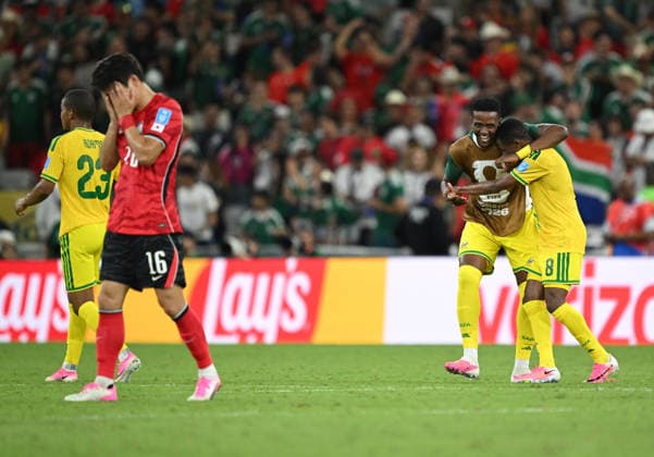 (260625) -- MONTERREY, June 25, 2026 -- Park Jin-seob (2nd L) of South Korea reacts as players of South Africa celebrate after a group A match between South Africa and South Korea at the 2026 FIFA World Cup, WM, Weltmeisterschaft, Fussball at Estadio Monterrey in Monterrey, Mexico, on June 24, 2026. (Photo by Xinhua) (SP)MEXICO-MONTERREY-FOOTBALL-FIFA WORLD CUP-GROUP A-RSA VS KOR LucioxTavora 