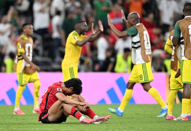 (260625) -- MONTERREY, June 25, 2026 -- A South Korean player sits on the ground as players of South Africa celebrate victory after a group A match between South Africa and South Korea at the 2026 FIFA World Cup, WM, Weltmeisterschaft, Fussball at Estadio Monterrey in Monterrey, Mexico, on June 24, 2026. ) (SP)MEXICO-MONTERREY-FOOTBALL-FIFA WORLD CUP-GROUP A-RSA VS KOR WuxWei 