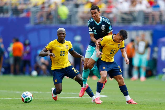New Jersey, USA, 25th June 2026. Jamal Musiala of Germany is challenged by Moises Caicedo (L) of Ecuador and Alan Franco of Ecuador during the Ecuador vs Germany FIFA World Cup, WM, Weltmeisterschaft, Fussball match at Metlife Stadium, New Jersey. Picture credit should read: Paul Terry Sportimage EDITORIAL USE ONLY. No use with unauthorised audio, video, data, fixture lists, club league logos or live services. Online in-match use limited to 120 images, no video emulation. No use in betting, games or single club league player publications. SPI_039_PT_Ecuador_Germany SPI-4841-0039
