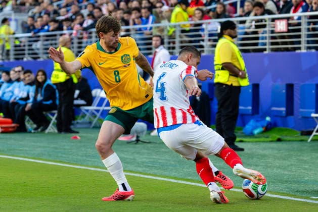 SANTA CLARA, CA - JUNE 25: Conor Metcalfe 8 of Australia and Juan Jose Caceres 4 of Paraguay battle for the ball during the FIFA World Cup, WM, Weltmeisterschaft, Fussball 2026 Group D match between Paraguay and Australia on June 25, 2026 at San Francisco Bay Area Stadium in Santa Clara, CA. (Photo by Matthew Huang Icon Sportswire) SOCCER: JUN 25 FIFA World Cup 26 Group D - Paraguay vs Australia EDITORIAL USE ONLY Icon260625008