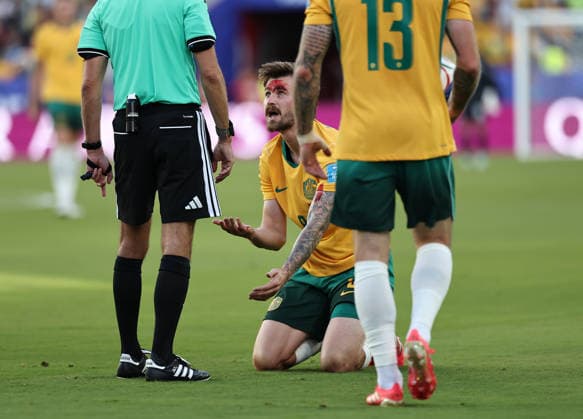 (260626) -- SAN FRANCISCO, June 26, 2026 -- Connor Metcalfe (C) of Australia speaks to referee Clement Turpin (L) after sustaining an injury during the group D match between Paraguay and Australia at the 2026 FIFA World Cup, WM, Weltmeisterschaft, Fussball at San Francisco Bay Area Stadium in San Francisco, the United States, June 25, 2026. (Photo by Xinhua) (SP)U.S.-SAN FRANCISCO-FOOTBALL-FIFA WORLD CUP-GROUP D-PRY VS AUS SongxHaiyuan 