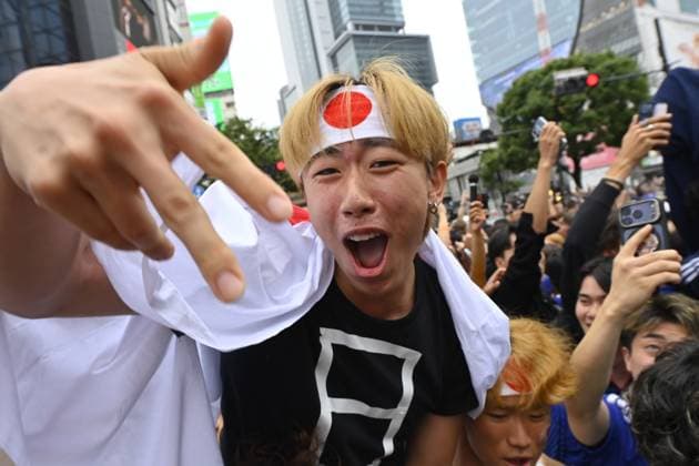 Fans Celebrate Japan s World Cup Qualification in Tokyo s Shibuy TOKYO, JAPAN - JUNE 26: Football supporters celebrate at the Shibuya Scramble Crossing after Japan advanced to the knockout stage of the FIFA World Cup, WM, Weltmeisterschaft, Fussball 2026 with a 1-1 draw against Sweden, in Tokyo, capital of Japan, on June 26, 2026. Large crowds repeatedly surged into the intersection between traffic light cycles while police officers worked to regulate pedestrian flows and maintain public order. David Mareuil Anadolu Tokyo Japan. Editorial use only. Please get in touch for any other usage.  Copyright: x2026xAnadoluxDavidxMareuilx