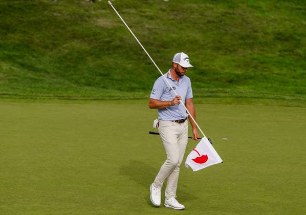 June 25, 2026, Cromwell, Connecticut, USA: Sam Burns (USA) removes the flag on the 18th green during the first round of the 2026 Travelers Championship at TPC River Highlands. GOLF 2026: Travelers Championship - Round 1  - ZUMAw109 20260625_fap_w109_047 Copyright: xDebbyxWongx
