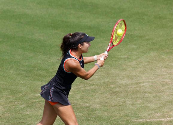 RECORD DATE NOT STATED 26th June 2026; Devonshire Park Lawn Tennis Club, Eastbourne, East Sussex, England; Lexus Eastbourne Open Tennis, Day Six; Petra Marcinko (CRO) plays a backhand shot against Madison Keys (USA) in the Womens semi-finals match HongboxChen