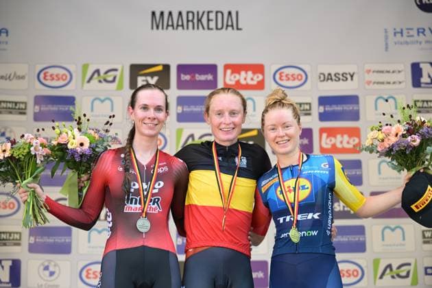 L-R, second Elite Women Sandrine Tas, winner Belgian champion Elite Women Lotte Claes and third Elite Women Margot Vanpachtenbeke celebrate on the podium of the women s elite individual road time trial race (20,5km) at the Belgian Cycling Championships, in Maarkedal, on Friday 26 June 2026. DAVIDxPINTENS  x179394168x