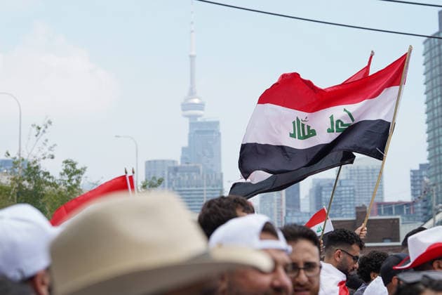 Senegal v Iraq - 2026 FIFA World Cup, WM, Weltmeisterschaft, Fussball Group I Iraqi flag waving with Toron to CN Tower behind during the 2026 FIFA World Cup Group I match between Senegal and Iraq at Toronto Stadium. on June 26, 2026 in Toronto, Canada. (Photo by Leonardo Ramirez Eyepix Group) Copyright: xLeonardoxRamirezx xEyepixxGroupx LR26062026-09903