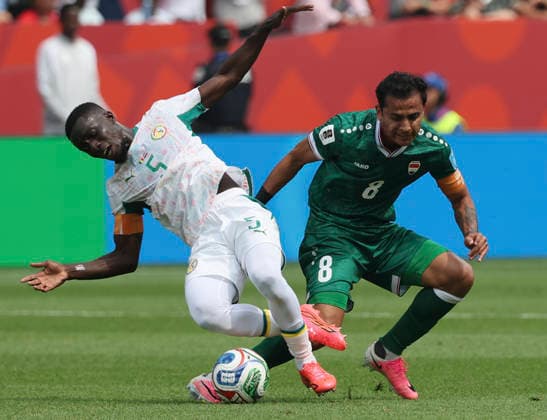 (260627) -- TORONTO, June 27, 2026 -- Ibrahim Bayesh (R) of Iraq vies with Idrissa Gana Gueye of Senegal during the group I match between Senegal and Iraq at the 2026 FIFA World Cup, WM, Weltmeisterschaft, Fussball at Toronto Stadium in Toronto, Canada, June 26, 2026. (Photo by Xinhua) (SP)CANADA-TORONTO-FOOTBALL-FIFA WORLD CUP-GROUP I-SEN VS IRQ ZouxZheng 