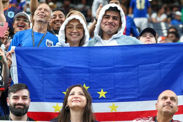 HOUSTON, TX - JUNE 26: Two fans where shark customs and hold up the Cabo Verde flag ahead of the FIFA World Cup, WM, Weltmeisterschaft, Fussball 2026 Group H match between Cabo Verde and Saudi Arabia on June 26, 2026, at Houston Stadium in Houston, Texas. (Photo by David Buono Icon Sportswire). SOCCER: JUN 26 FIFA World Cup 26 Group H - Cabo Verde vs Saudi Arabia EDITORIAL USE ONLY Icon260626008