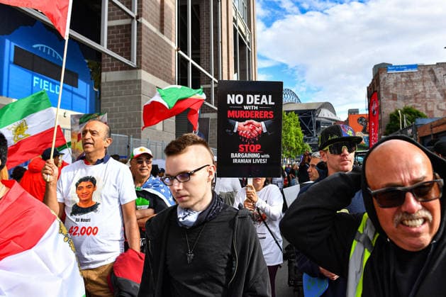 June 26, 2026: Iranian anti-regime protesters march with signs outside Seattle Stadium before the FIFA World Cup, WM, Weltmeisterschaft, Fussball match between Egypt and Iran in Seattle, WA. CSM FIFA World Cup 2026: JUN 26 Egypt Vs Iran  - ZUMAc04_ 20260626_zma_c04_271 Copyright: xStevexFaberx