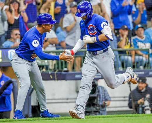 Chicago Cubs designated hitter Seiya Suzuki (R) celebrates with Chicago Cubs third base coach Quintin Berry (L) after hitting a home run in the fifth inning of the MLB, Baseball Herren, USA game between the Chicago Cubs and the Milwaukee Brewers at American Family Field in Milwaukee, Wisconsin on Friday, June 26, 2026.  MIL20260626815 TANNENxMAURY