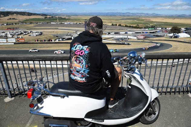 SONOMA, CA JUNE 26: A fan on moped watches the cars as they complete a caution lap during the ARCA Menards Series West General Tire 150 on June 26, 2026, at Sonoma Raceway in Sonoma, CA. (Photo by Chris Williams Sonoma Raceway Icon Sportswire) AUTO: JUN 26 ARCA Menards Series West General Tire 150 EDITORIAL USE ONLY Icon0072606260133