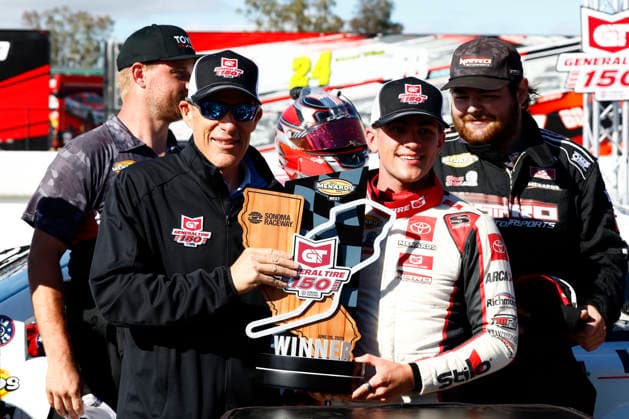 SONOMA, CA - JUNE 26: Sam Corry* ( 25 Bruce Toyota) poses with the winners trophy and Sonoma Executive Vice President and General Manager Brian Flynn, left, after winning the General Tire 150 ARCA Menards Series West race on June 26, 2026, at Sonoma Raceway in Sonoma, CA. (Photo by Jeff Speer Sonoma Raceway Icon Sportswire) AUTO: JUN 26 ARCA Menards Series West General Tire 150 EDITORIAL USE ONLY Icon2606265775