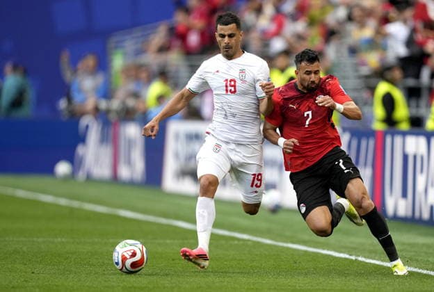FIFA World Cup, WM, Weltmeisterschaft, Fussball 2026 - Group G - Egypt vs Iran Trezeguet (R) of Egypt and Ali Nemati of Iran in action during the FIFA World Cup 2026 group stage match Egypt against Iran, in Seattle, USA, 26 June 2026. SEATTLE United States  Copyright: xSTEPHENxBRASHEARx
