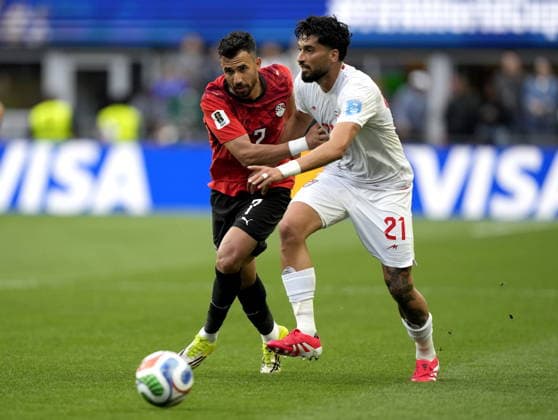 FIFA World Cup, WM, Weltmeisterschaft, Fussball 2026 - Group G - Egypt vs Iran Trezeguet (L) of Egypt and Mohammad Ghorbani of Iran in action during the FIFA World Cup 2026 group stage match Egypt against Iran, in Seattle, USA, 26 June 2026. SEATTLE United States  Copyright: xSTEPHENxBRASHEARx