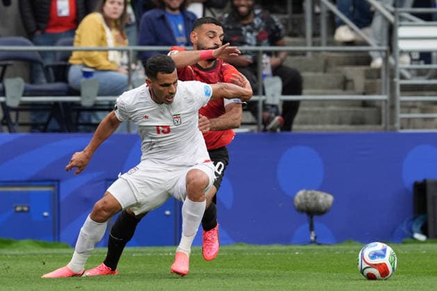 Mehdi Ghayedi (back) of Egypt vies for the ball with Roozbeh Cheshmi of Iran during a Group G match at the 2026 FIFA World Cup, WM, Weltmeisterschaft, Fussball between Egypt and Iran at Lumen Field in Seattle, United States, 26 June 2026. FIFA World Cup 2026 - Group G - Egypt vs Iran !ACHTUNG: NUR REDAKTIONELLE NUTZUNG!  Copyright: xOmarxAlonsox AME5080 20260627-55020725039_1